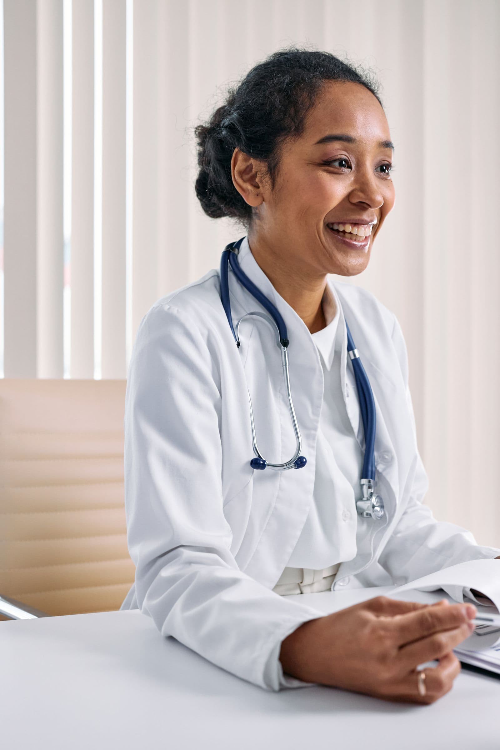 A smiling doctor in a bright clinic