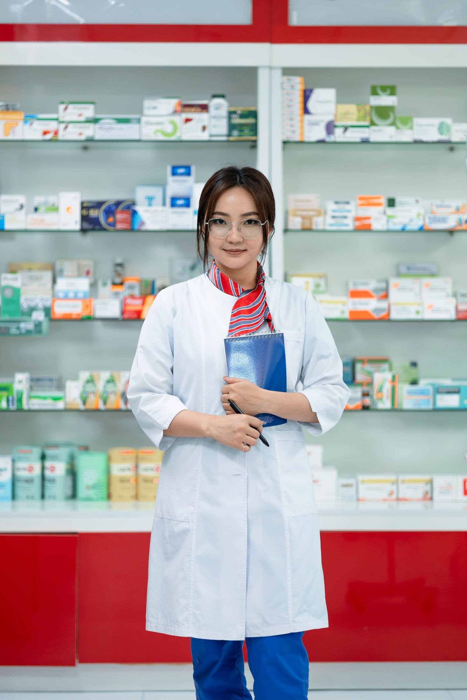 A pharmacist in a bright, modern pharmacy
